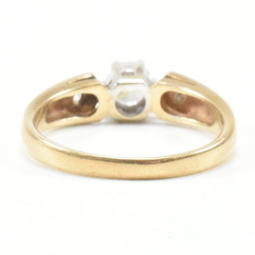 182 - A hallmarked 9ct yellow gold and cubic zirconia engagement style ring. The ring having a round cut w... 