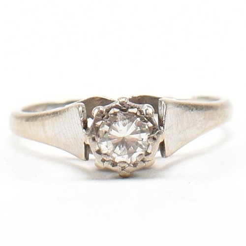 227 - A hallmarked 18ct gold diamond solitaire ring. The ring set with a round brilliant cut diamond in a ... 