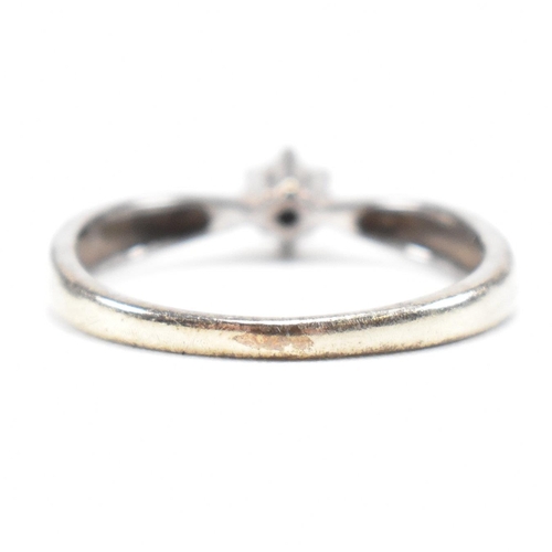 228 - A hallmarked 9ct gold and white stone solitaire ring. The single stone engagement style ring having ... 