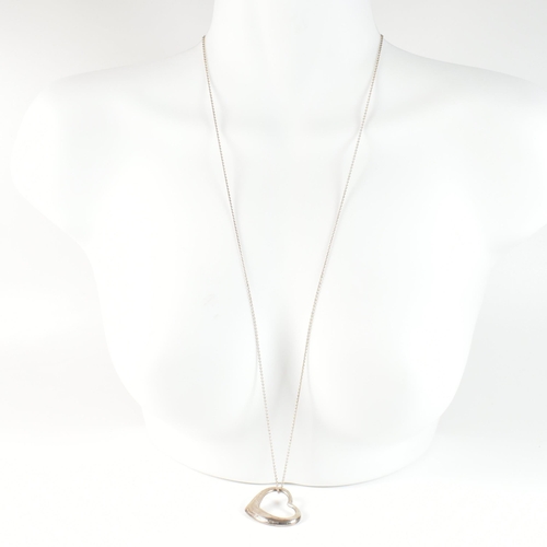 229 - A Tiffany and Co Elsa Peretti silver open heart pendant necklace. The necklace having a hallmarked 9... 