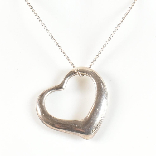 229 - A Tiffany and Co Elsa Peretti silver open heart pendant necklace. The necklace having a hallmarked 9... 