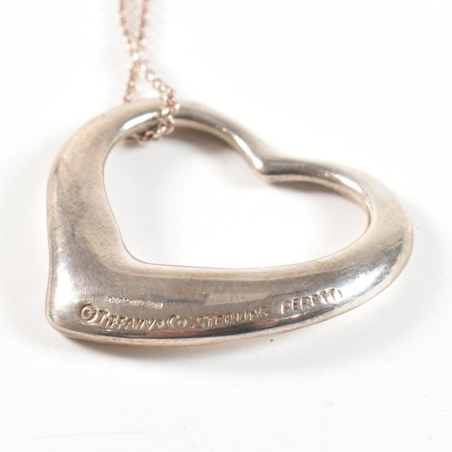 229 - A Tiffany and Co Elsa Peretti silver open heart pendant necklace. The necklace having a hallmarked 9... 
