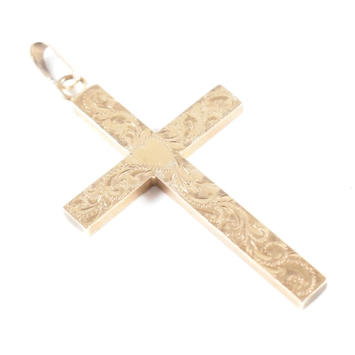 257 - A vintage hallmarked 9ct yellow gold necklace pendant. The pendant in the form of a cross having rep... 