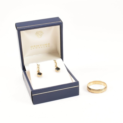 258 - A hallmarked 9ct gold band ring together with a pair of 9ct gold and sapphire pendant earrings. The ... 