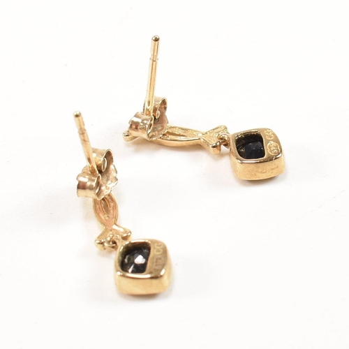 258 - A hallmarked 9ct gold band ring together with a pair of 9ct gold and sapphire pendant earrings. The ... 