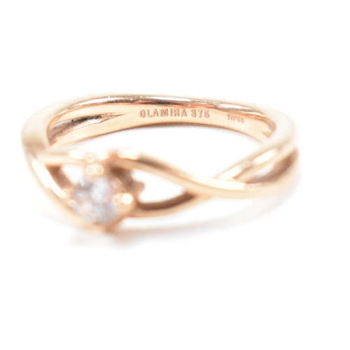297 - A hallmarked 9ct rose gold and white stone solitaire crossover ring. The single stone engagement sty... 