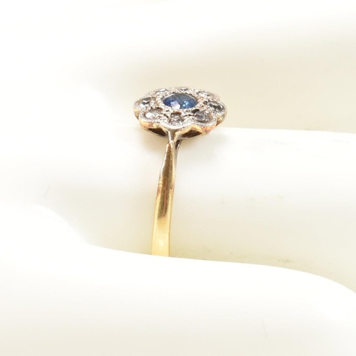 298 - A 1920s 18ct gold, sapphire and diamond cluster ring. The early 20th century ring having a central r... 