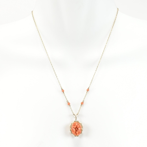 40 - A hallmarked 9ct gold, carved precious coral and pearl pendant necklace. The necklace having preciou... 