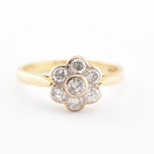 41 - A hallmarked 18ct gold and diamond cluster ring. The ring set with 7 diamonds, estimated diamond wei... 