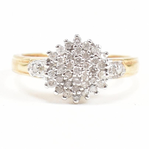 456 - A hallmarked 18ct gold and diamond cluster ring. The ring having a cluster of round cut diamonds wit... 