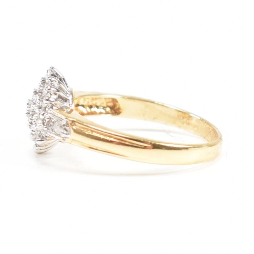 456 - A hallmarked 18ct gold and diamond cluster ring. The ring having a cluster of round cut diamonds wit... 