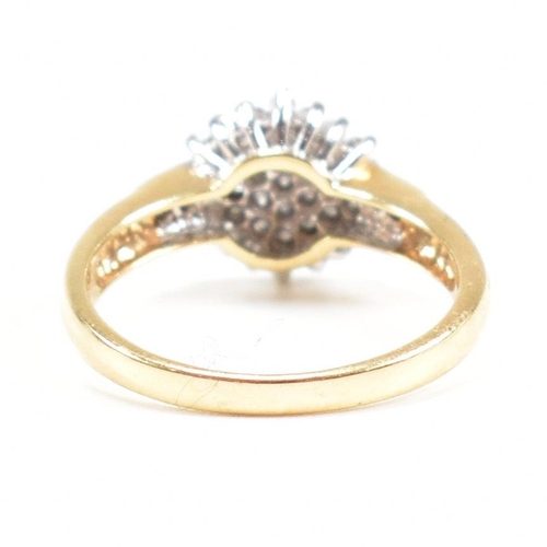 456 - A hallmarked 18ct gold and diamond cluster ring. The ring having a cluster of round cut diamonds wit... 