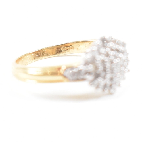 456 - A hallmarked 18ct gold and diamond cluster ring. The ring having a cluster of round cut diamonds wit... 