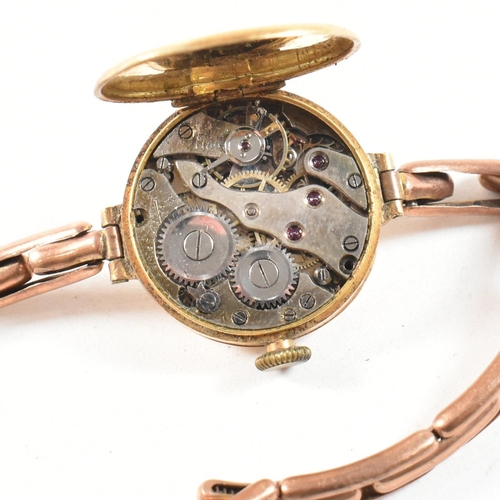 457 - A gold early 20th century ladies dress watch. Silvered dial with Arabic numeral chapter ring. Set to... 