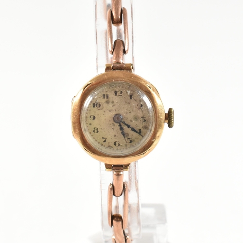 457 - A gold early 20th century ladies dress watch. Silvered dial with Arabic numeral chapter ring. Set to... 