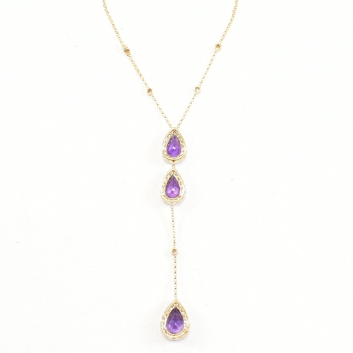 31 - An 18ct gold, amethyst and diamond pendant necklace. The necklace strung with a pear cut amethyst su... 