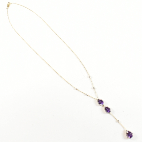 31 - An 18ct gold, amethyst and diamond pendant necklace. The necklace strung with a pear cut amethyst su... 