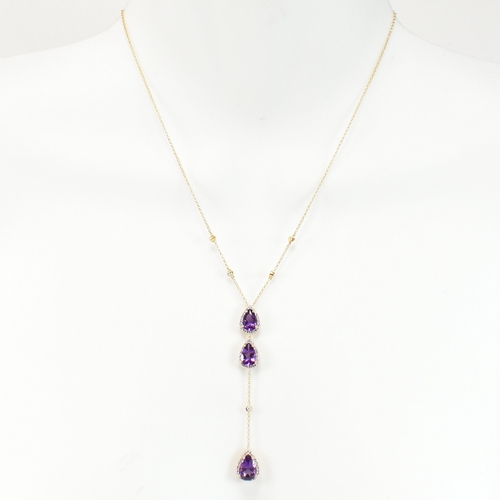 31 - An 18ct gold, amethyst and diamond pendant necklace. The necklace strung with a pear cut amethyst su... 