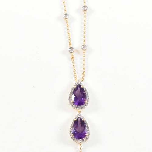 31 - An 18ct gold, amethyst and diamond pendant necklace. The necklace strung with a pear cut amethyst su... 