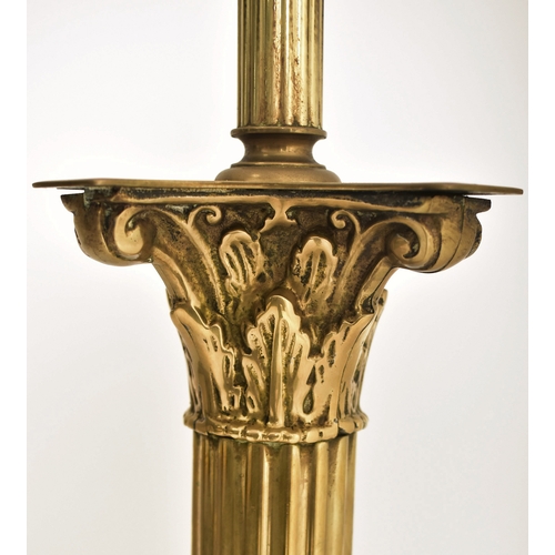 282 - An early 20th century brass Neoclassical style floor standard lamp. The lamp having a Corinthian sha... 