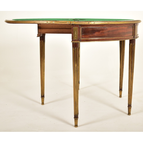 541 - A French Biedermeier 19th century mahogany and brass bound games / card table or roulette table. The... 