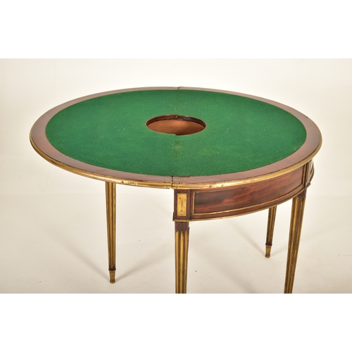 541 - A French Biedermeier 19th century mahogany and brass bound games / card table or roulette table. The... 