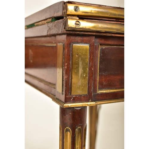 541 - A French Biedermeier 19th century mahogany and brass bound games / card table or roulette table. The... 