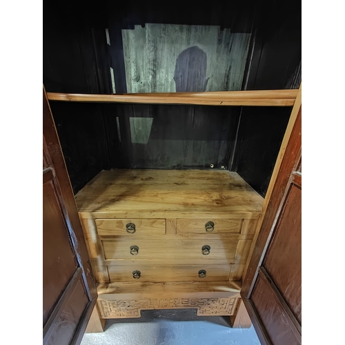 614 - A pair of Chinese Qing Dynasty elm inspired marriage two door wardrobes. Each having a straight top ... 