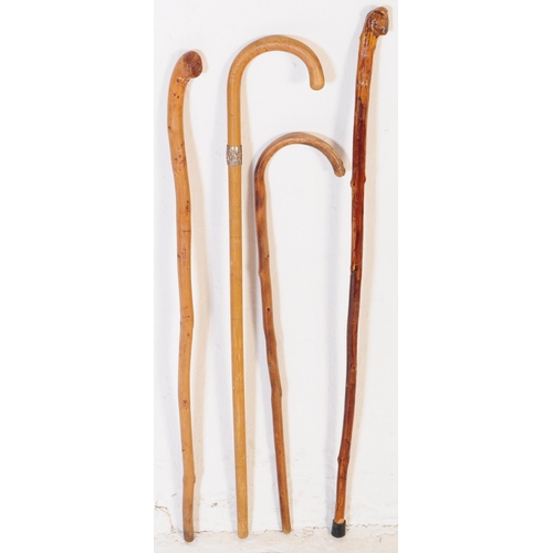 198 - A collection of vintage 20th century walking sticks / swagger canes. Including shepherds hook handle... 