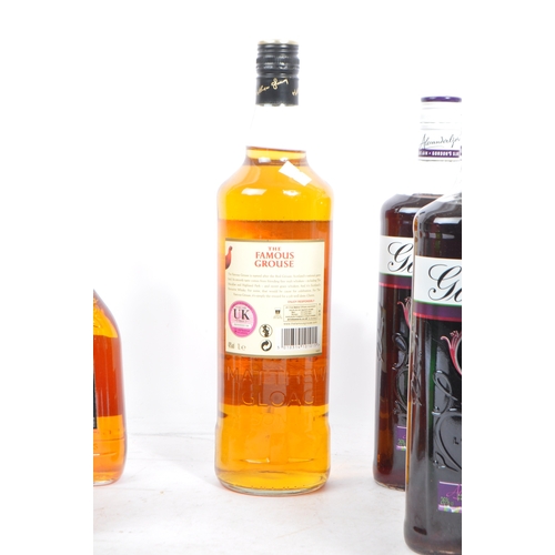 200A - A large collection of unopened alcohol spirit bottles. The collection to include twelve bottles of G... 