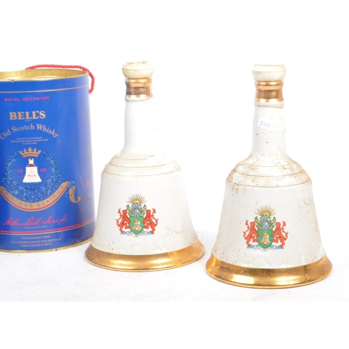 202A - Bells - A collection of five royal commemorative Bells scotch whisky bottles / decanters. The collec... 