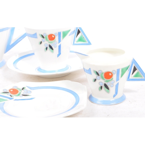 22 - Eric Slater for Shelley - An early 20th century Art Deco Shelley blue 'J' Mode part tea service. The... 