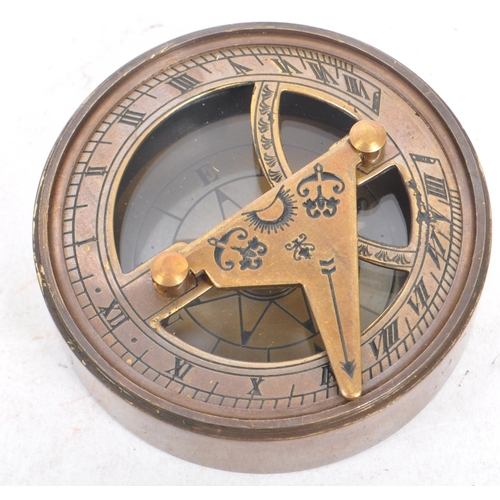 240 - A contemporary brass cased compass and sundial. The lid of the case being inscribe 'The Mary Rose, L... 