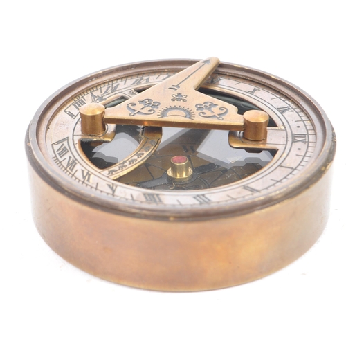 240 - A contemporary brass cased compass and sundial. The lid of the case being inscribe 'The Mary Rose, L... 