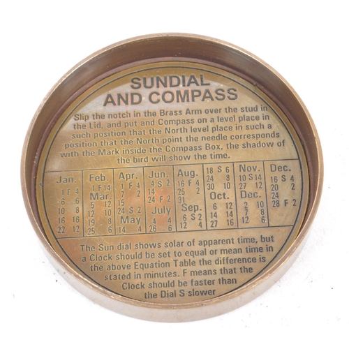 240 - A contemporary brass cased compass and sundial. The lid of the case being inscribe 'The Mary Rose, L... 