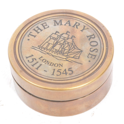 240 - A contemporary brass cased compass and sundial. The lid of the case being inscribe 'The Mary Rose, L... 