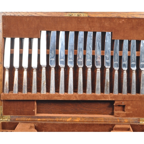 302 - An oak canteen of EPNS flatware and cutlery for eight settings, by A. E. Poston & Co. Ltd. Some serv... 