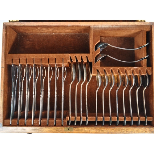 302 - An oak canteen of EPNS flatware and cutlery for eight settings, by A. E. Poston & Co. Ltd. Some serv... 