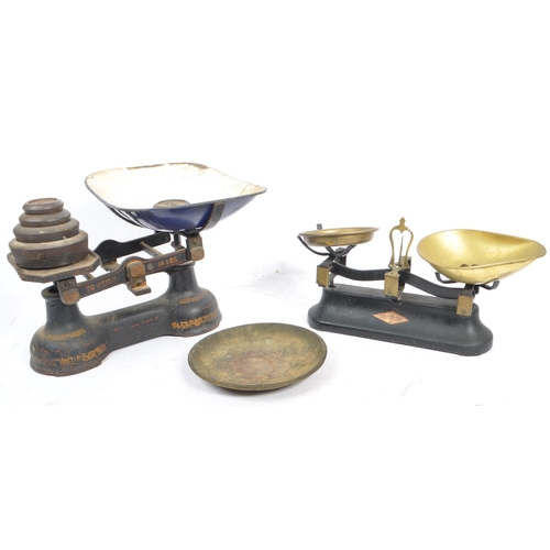 311 - A pair of early 20th century ebonised cast metal grocers shop scales by Ashworth and Preston & Thoma... 