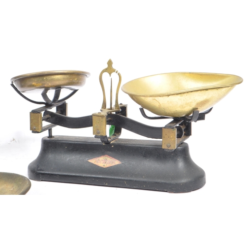 311 - A pair of early 20th century ebonised cast metal grocers shop scales by Ashworth and Preston & Thoma... 