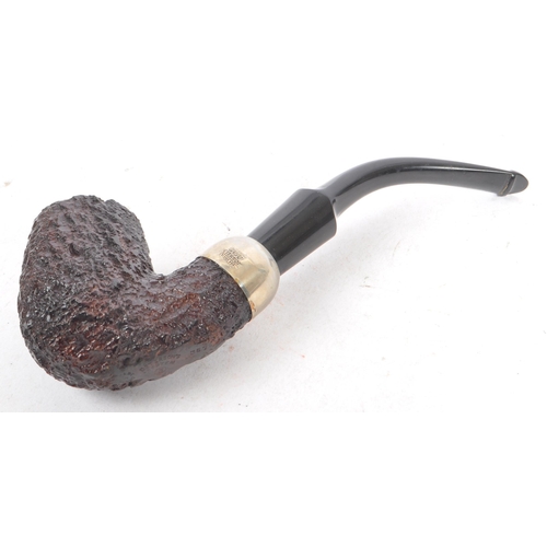 314 - A mid 20th century circa 1940s Peterson's system 357 pipe. Having marking to bottom of wooden bowl, ... 