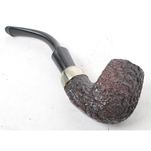 314 - A mid 20th century circa 1940s Peterson's system 357 pipe. Having marking to bottom of wooden bowl, ... 