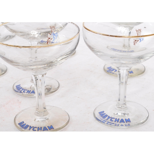 32 - Babycham - A collection of eight mid 20th century Babycham coupe glasses. Each glass having a gilt e... 