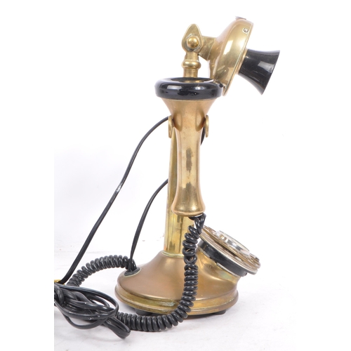 351 - A 20th century vintage 'Conversation Pieces' brass and Bakelite candlestick telephone with chrome me... 