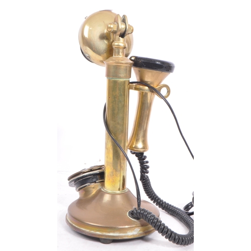 351 - A 20th century vintage 'Conversation Pieces' brass and Bakelite candlestick telephone with chrome me... 