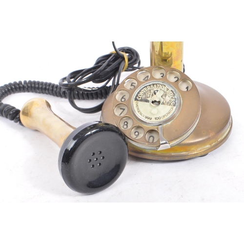 351 - A 20th century vintage 'Conversation Pieces' brass and Bakelite candlestick telephone with chrome me... 