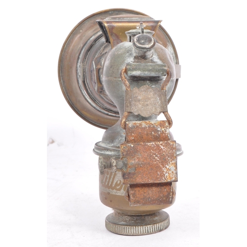 352 - An early 20th century Miller Regalite cycle lamp. The lamp having a large convex lens with hood to f... 