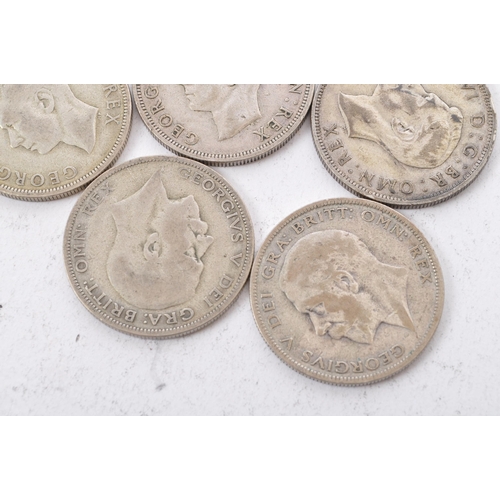 515 - A collection of five George V and three George VI circulated silver half crown coins. The lot to inc... 