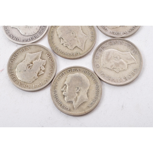 517 - A collection of six George V and two George VI circulated silver half crown coins. The lot to includ... 