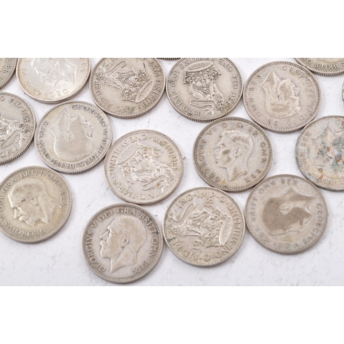 518 - A collection of approximately thirty early 20th century (pre 1947) .500 silver George V and George V... 